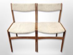A pair of Danish teak framed dining chairs