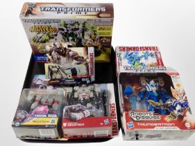 A group of Hasbro Transformers figures, boxed.