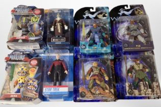 A group of boxed figurines including Warriors of Virtue, World of Warriors, and Star Trek.