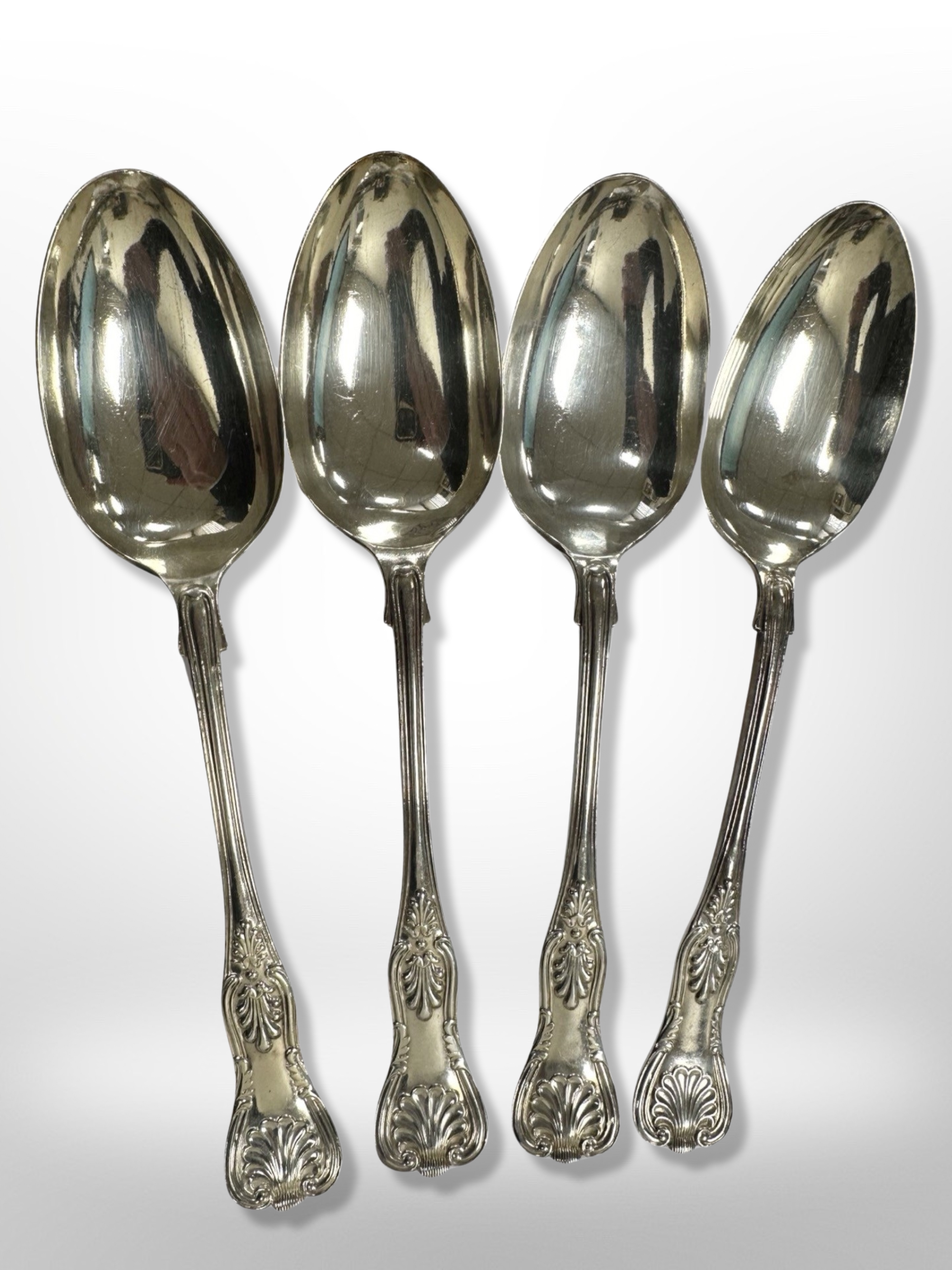 A set of four Edwardian silver table spoons, Mappin & Webb, Sheffield 1904, length 21.5cm.