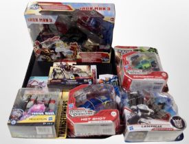 A group of Hasbro Transformers and Iron Man 3 figures, boxed.