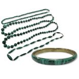 A malachite bangle and four similar polished bead necklaces