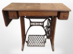 A Singer oak treadle sewing machine,