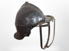 A reproduction metal and resin Civil War-style helmet, and a further tin helmet.