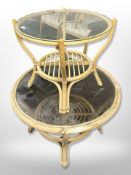 Two bentwood and wicker circular glass topped coffee tables,