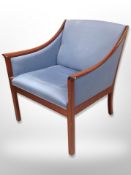 A 20th century teak framed armchair in blue fabric,