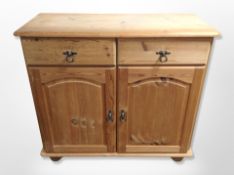 A contemporary pine double door side cabinet,