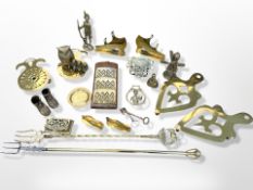 A collection of brass wares, trivets, toasting forks, small trinket box,