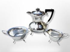 A silver-plated three-piece tea service, teapot 22 cm high.