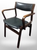 A continental open armchair in green leather seat,