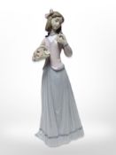 A Lladro figure - Innocence in Bloom number 7644, boxed.