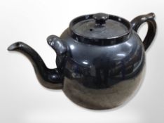 A large glazed terracotta teapot,