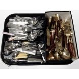 A collection of Thai brass cutlery and further stainless steel table cutlery