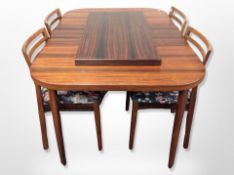 A rosewood extending dining table, with two leaves, total length 200 cm,