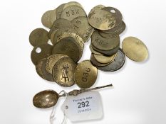 Thirty six vintage railway tokens, together with an ornate silver gilt teaspoon.