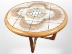 A Danish tiled topped circular coffee table with X-shaped under-stretcher,