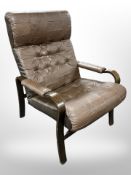 A 20th century Danish bentwood brown stitched leather armchair,