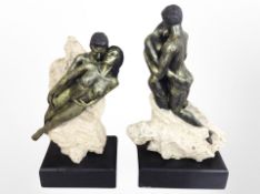 A pair of contemporary resin statues on plinths modelled as nude lovers, height 27cm.