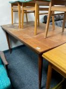 A Danish teak extending pull-out dining table,