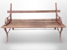 A cast iron framed painted garden bench,