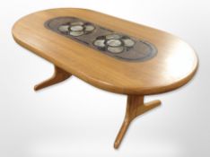 A Danish teak tiled topped oblong coffee table,