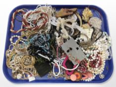 A tray of costume necklaces and other jewellery