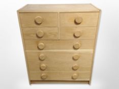A Danish oak veneered eight drawer chest,