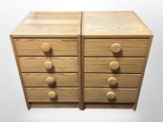 A pair of Danish pine four drawer chests,