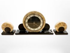 An Art Deco marble and polished slate three-piece clock garniture, clock 20cm high.