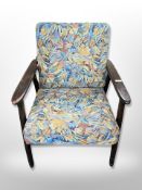 A 20th century Continental armchair in floral upholstery