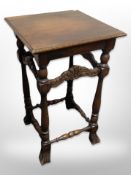 A carved beech occasional table,