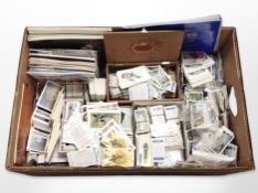 A box of cigarette cards and tea cards including John Player & Sons,