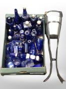 A collection of blue glass ware including various bottles, vases,
