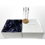 A set of six silver olive skewers on turned wood stand, by J A Campbell of London, boxed.