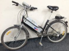 A Powabyke electric cycle with charger and battery pack