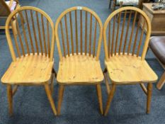 Three pine spindle backed dining chairs
