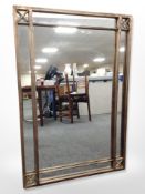 A contemporary metal framed mirror,