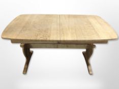A Danish blond oak extending refectory dining table with leaf,