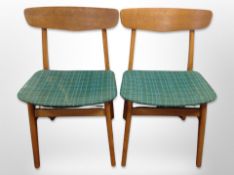 A pair of 20th century Danish beech dining chairs in turquoise upholstery
