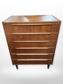 A Danish teak and pine six drawer chest,