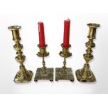 Two pairs of brass candlesticks,