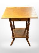 An oak two tier occasional table,