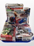 A group of Hasbro Transformers figures, boxed.