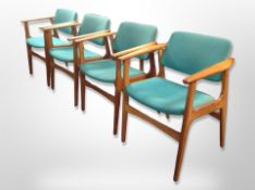 A set of four Danish 20th century teak armchairs in turquoise fabric