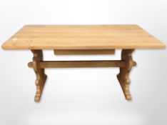 A blond oak refectory dining table,