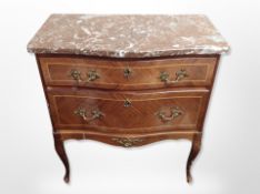 A Continental kingwood and gilt metal mounted serpentine two drawer chest with rouge marble top,