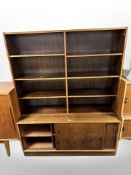 A Danish rosewood bookcase with sliding doors cupboards beneath,