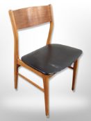 A Danish teak dining chair with black vinyl seat and a further chair