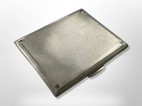 A George V silver cigarette case with engine-turned decoration, Smith & Bartlam, Birmingham 1935,