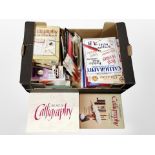 A collection of calligraphy items, boxed brushes and inks, pencils,